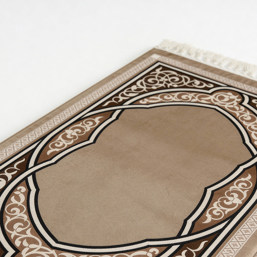 Beige prayer mat close-up with brown and white ornate arch border