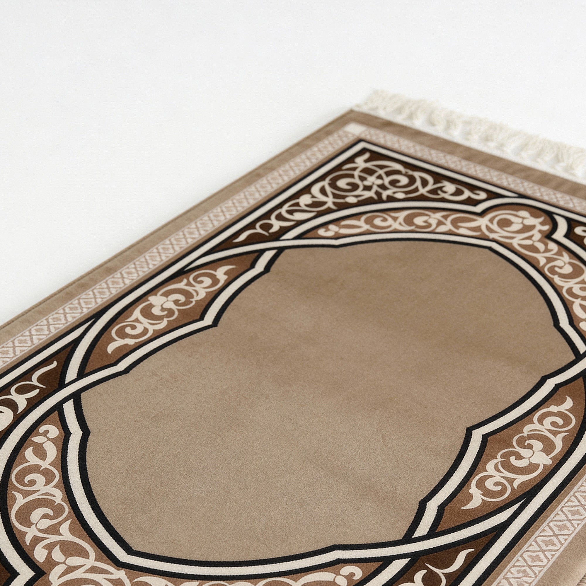 Beige prayer mat close-up with brown and white ornate arch border