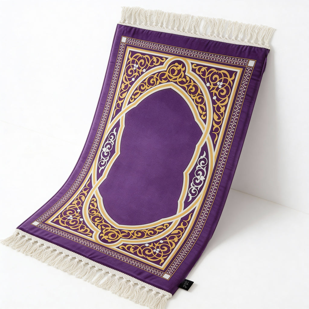 Purple prayer mat with gold and cream arch pattern and white tassel fringe