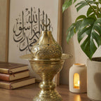 Copper incense burner standing with decorative top finial and ornate base