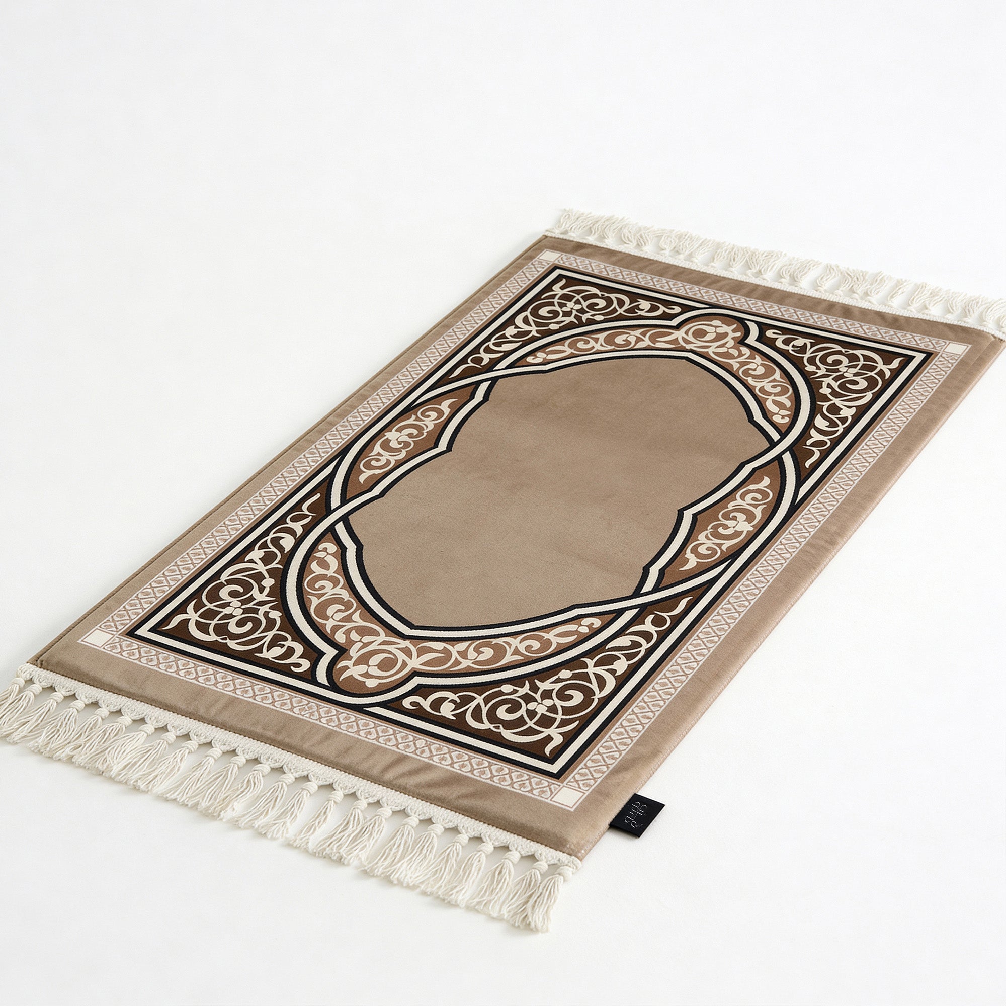Padded prayer mat in beige with brown arch pattern and white tassel fringe