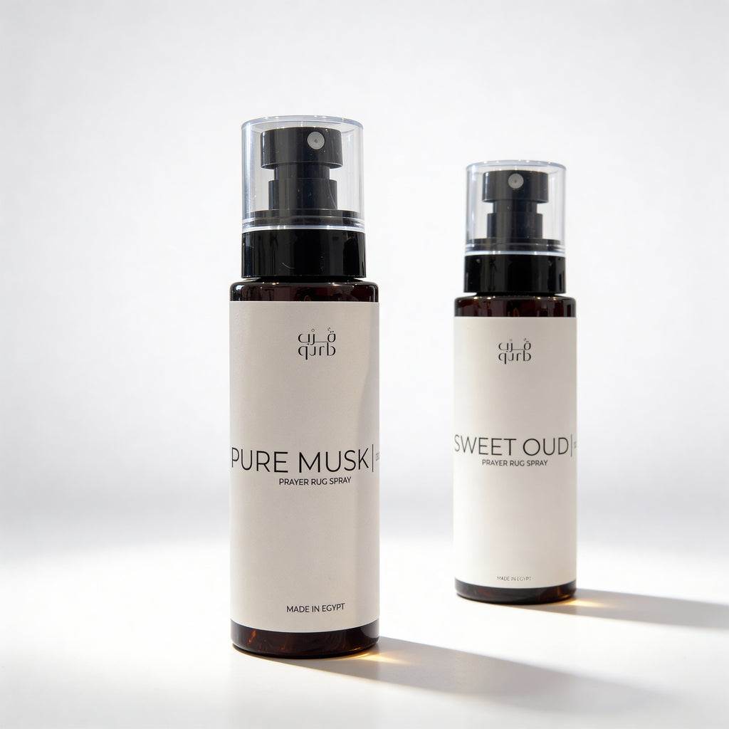 Two bottles of 'Pure Musk' and 'Sweet Oud' by 'al'Qura' on a light background