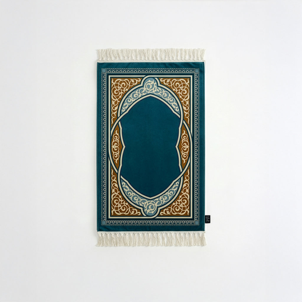 Padded prayer mat with teal border, dark blue arch medallion, and white fringe tassels