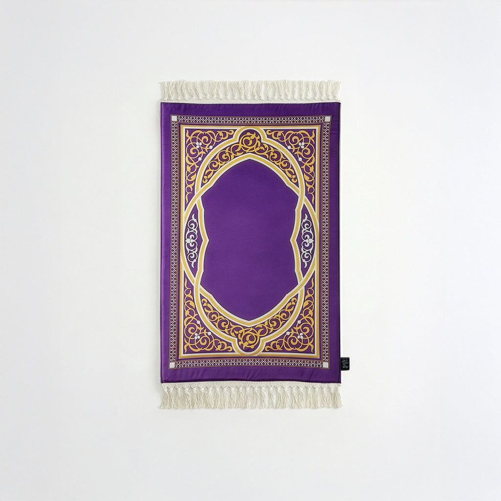Padded prayer mat with purple border, purple arch medallion, and white fringe tassels