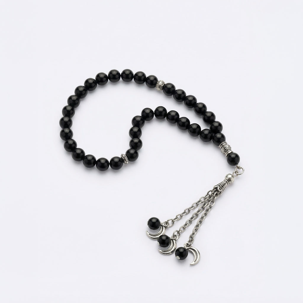 Black beaded prayer bracelet with silver-tone crescent charm and chain ends