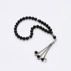 Black beaded prayer bracelet with silver-tone crescent charm and chain ends
