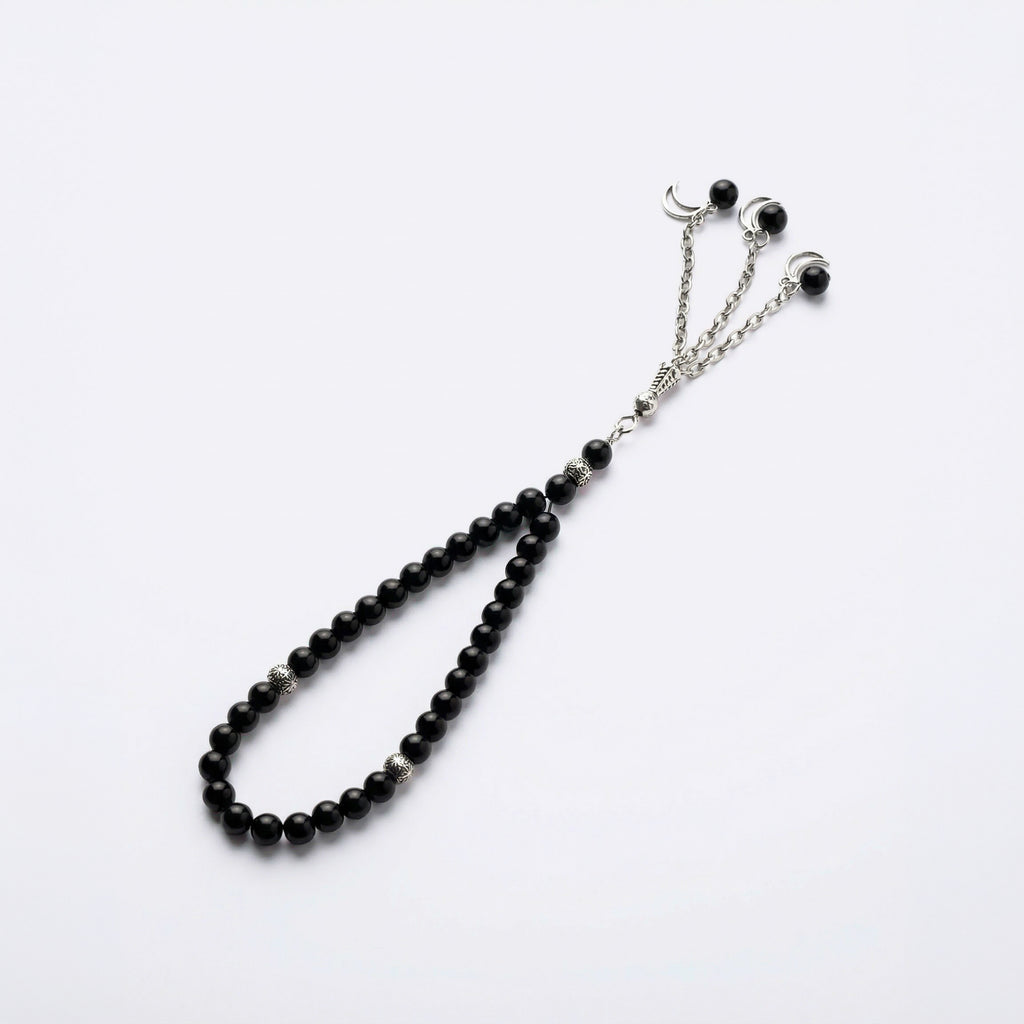 Black beaded prayer bracelet with crescent charms and silver-tone chain