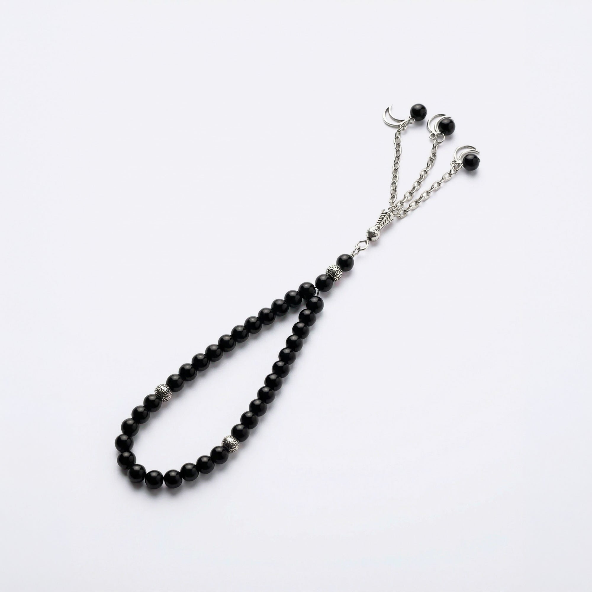 Black beaded prayer bracelet with crescent charms and silver-tone chain