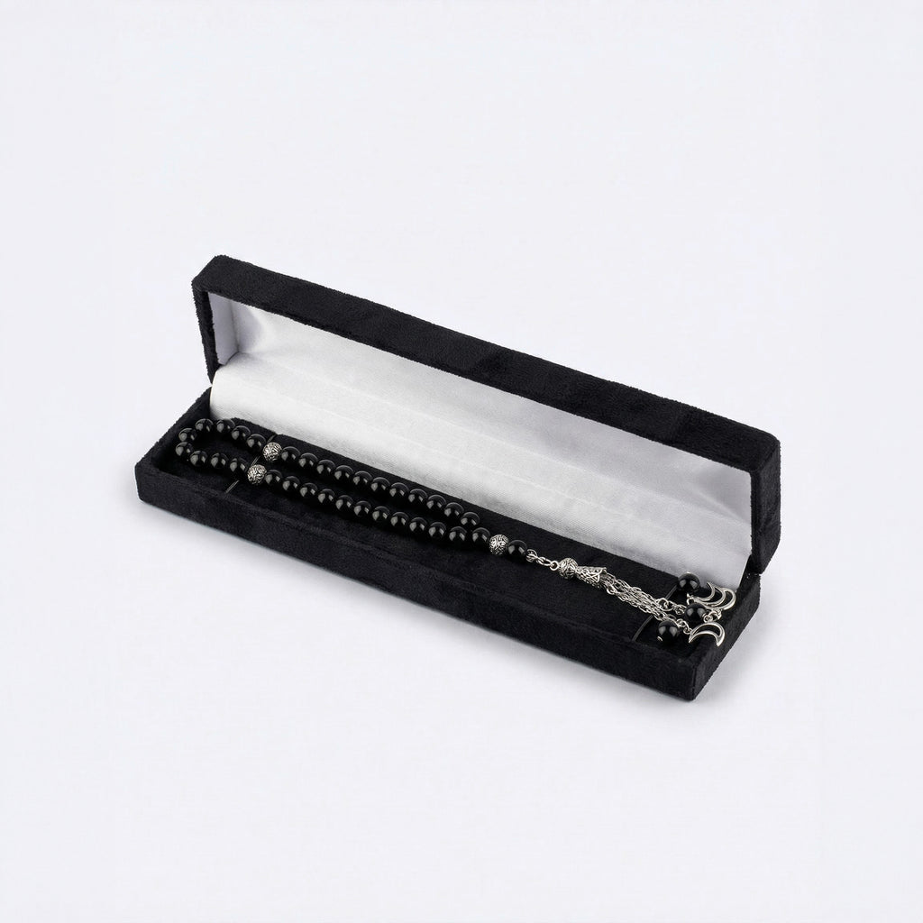 Black beaded prayer set in black velvet box with silver-tone chain and charms