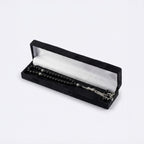 Black beaded prayer set in black velvet box with silver-tone chain and charms